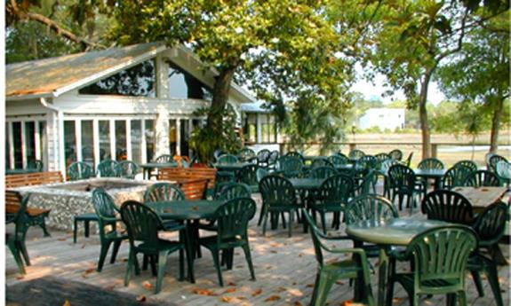 Beautiful outdoor dining under the Magnolia and Oak trees at Creekside Dinery.
