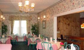 Once a familiy home, Le Pavillion Restaurant offers comfortable dining rooms throughout.