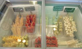 A variety of homemade gourmet popsicles in a cooler