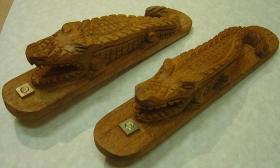 Hand-carved wooden gator bottle openers at Indigenous Arts.