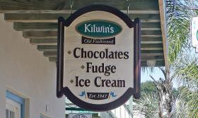 Kilwin's sign hangs up front advertising chocolates, fudge, and ice cream