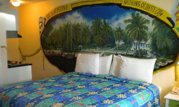 Large room with queen sized bed and fully equipped kitchenette. 