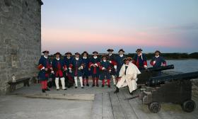The crew of Fort Matanzas on the main deck during sunrise