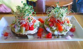 Interesting looking appetizers featuring fresh vegetables and sprouts at the Present Moment Cafe.