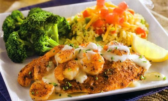 Creole-seasoned tilapia topped with sautéed shrimp and cream. 