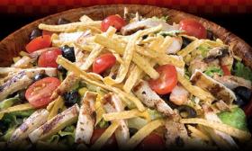 Healthy salads with barbeque meats are available at Wood'y in St. Augustine.
