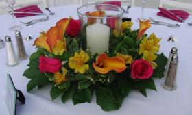 A colorful centerpiece created by Jade Violet Wedding Floral for a wedding in St. Augustine.