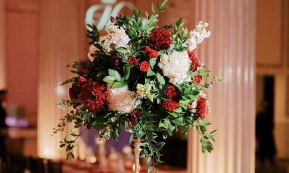 A tall centerpiece created by Jade Violet Wedding Floral in St. Augustine. Photo by Angelita Photo.