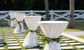 Tables decorated for an outdoor wedding reception by Jade Violet Wedding Floral in St. Augustine. Photo by Life and Love Studio.