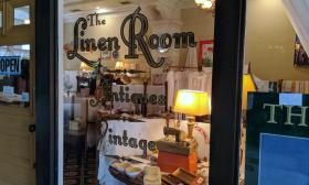 Suitably evocative of an old shop in England, the entrance to the Linen Room in St. Augustine, offers vintage treasures from across the Atlantic to shoppers in St. Augustine.