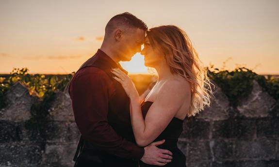 A couple catching the sunset at Castle Ottis courtesy of Lunar Kiss Photography in St. Augustine.