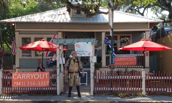 Meili Old Town Tours meets on Cordova Street at the Love Tree Cottage