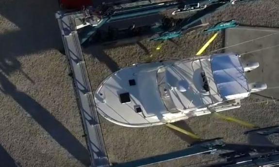 A boat being lifted at Oasis Boat Yard and Marina in St. Augustine.