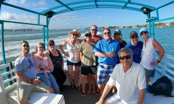 Folks enjoying the ride while others pedal an Old Town Cycle Cruise tour boat in St. Augustine.