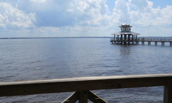 The covered short and long pier overlooking the water