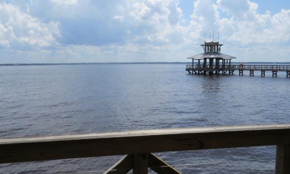 The covered short and long pier overlooking the water