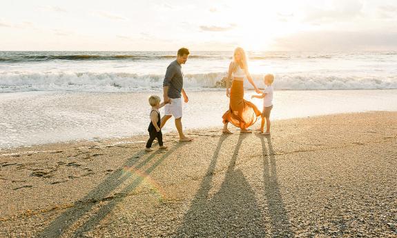 Ryaphotos capturing a family in the sunlight on St. Augustine Beach.