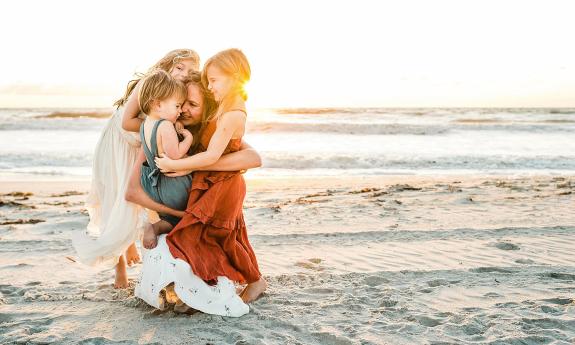 Ryaphotos capturing a family in the sunlight on St. Augustine Beach.