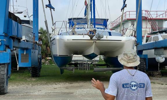 Lifting and moving a catamaran at St. Augustine Marine Center on the San Sebastian River in St. Augustine.