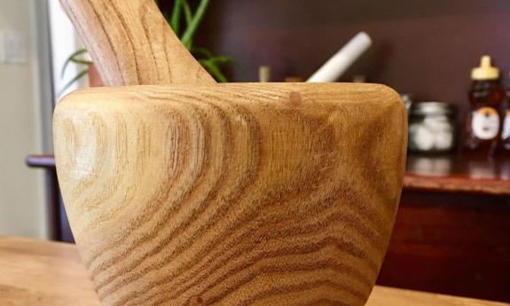 A record of a mortar and pestle exists from 1550 BC. Here's a newer one at Santa Barbara Hospital Museum in St. Augustine.