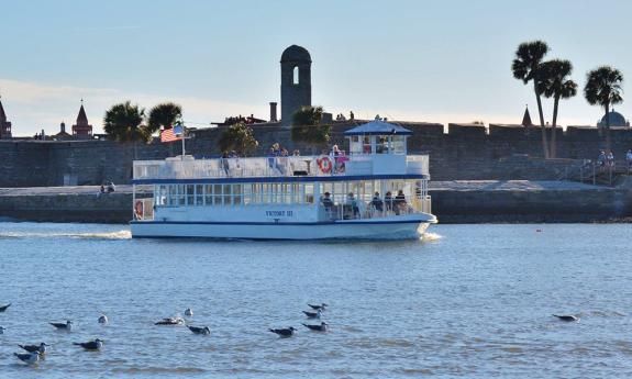 Scenic Cruise boat in front of the Castillo de San Marcos