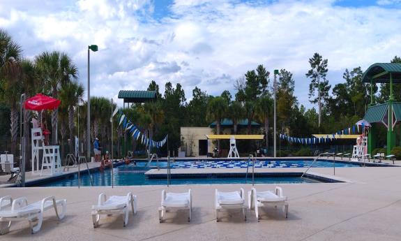 The pool area with lounge chairs on the deck