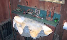 This sink made out of a shell is an example of the unusual ambience of Stetson Kennedy's homestead at Beluthahatchee Park.