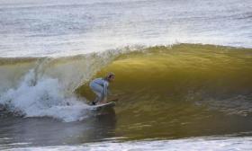 A Surf Station surfer enjoys a wave in St. Augustine Beach, FL
