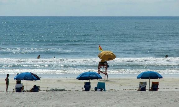 Enjoy a comfortable day on the beach with chairs and umbrellas from Barney's Beach Service.