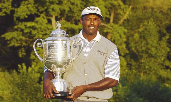 Male golfer with trophy 