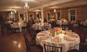 The tables are set at The Loft at The White Room wedding venue in St. Augustine.