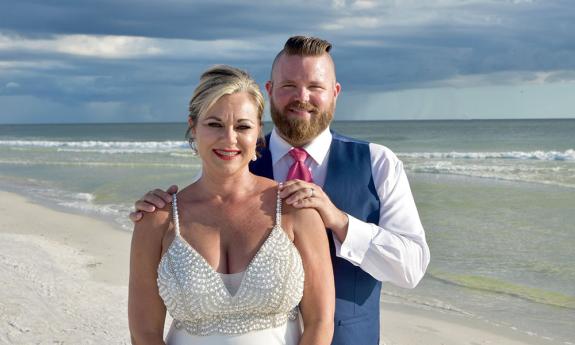 bride and groom smiling 