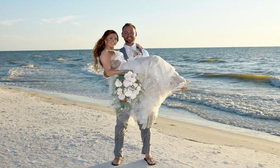 groom holding bride 