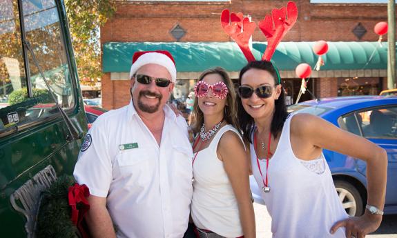 Tour organizers stop for a photo with their Old Town Trolley tour guide.