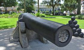 The cannons sit in the park for visitors to examine and take photos at