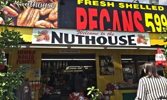 The outside signage of the Pecan Outlet