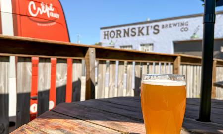 Hornski's viewed from the ouside deck, with a glass of their pilsner on the table