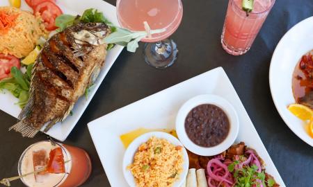 Multiple dishes and drinks prepared at Casa Maya in St. Augustine