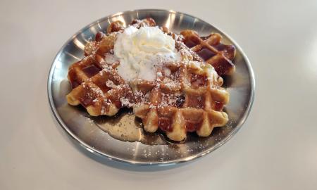 Leige waffles with whipped cream on top