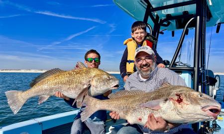 A group with their prized fish onboard