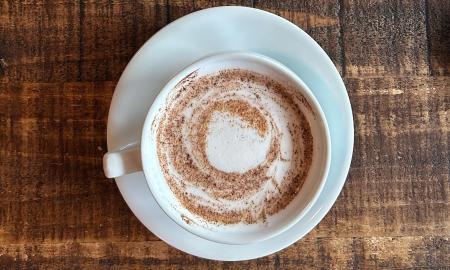 A hot latte served in a mug
