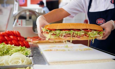 A worker making a sandwich