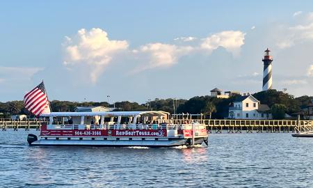 The Pelican vessel for the Red Boat Water Tours going past St. Augustine Lighthouse