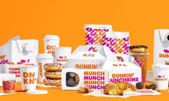 Dunkin' Donuts assortment of donuts, egg sandwiches, and coffees. 