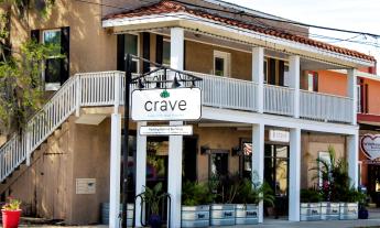 The entry to Crave restaurant, serving healthy wraps, salads, bowls, and smoothies, in St. Augustine, FL