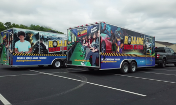 An exterior shot of the game truck in a parking lot. 