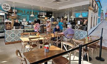 The interior of Paladar Cuban Eatery near Butler Beach offers a Caribbean vibe with bright aqua decor