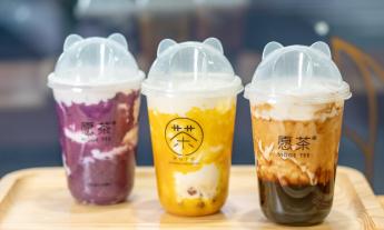 Various flavors of Moge Tea drinks on a culinary board