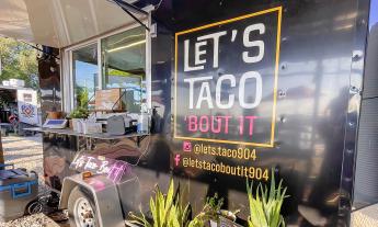 The exterior of the Let's Taco 'Bout It food truck