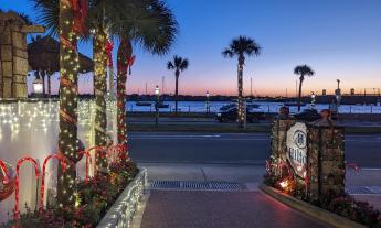 The bayfront at sunrise adn the entrance to the Bayfront Hilton during Nights of Lights